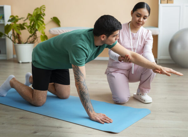 Physiotherapy in Vasundhara — Corefit Physiocare specialist treating a patient